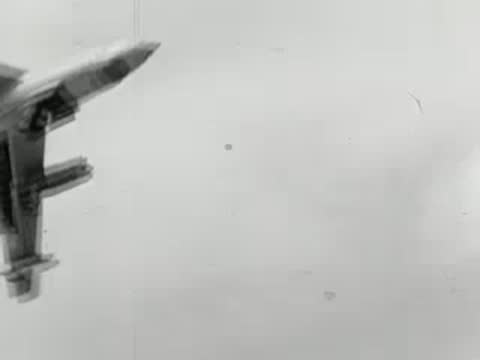 B-52 bombers flying across cloudy sky, historical military footage