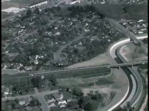 Aerial view of winding road and suburban homes