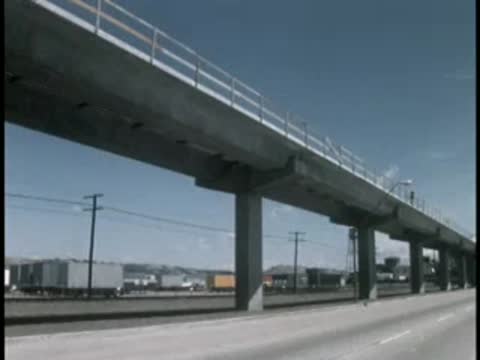 Elevated concrete transit viaduct along highway