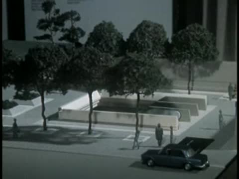 Model display of a park area with trees and plaza