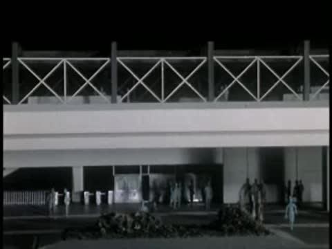 Model display of building facade with decorative railing