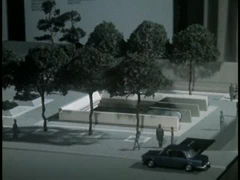 Architectural model of urban plaza with trees and cars