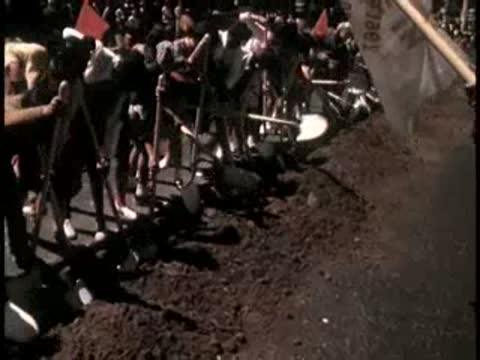 Crowd gathered outdoors during a groundbreaking ceremony