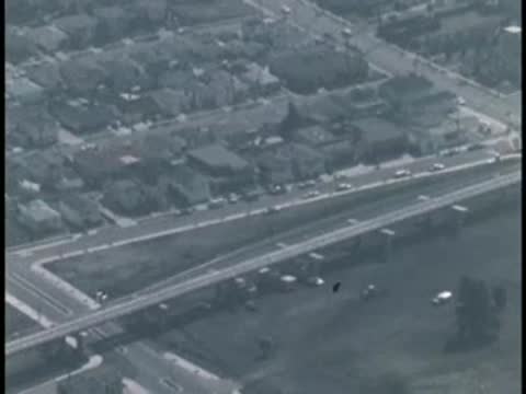Aerial view of suburban housing tracts and intersecting roadways.