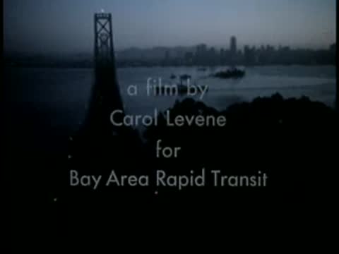 Bay Bridge tower in silhouette with text overlay against a dark water background.