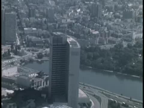 Aerial view of high-rise buildings and waterfront park