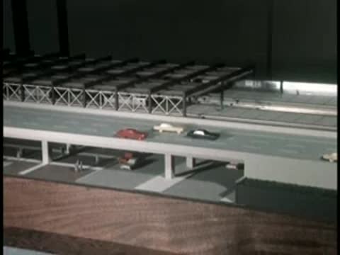 Miniature architectural scale model showing an elevated highway system.