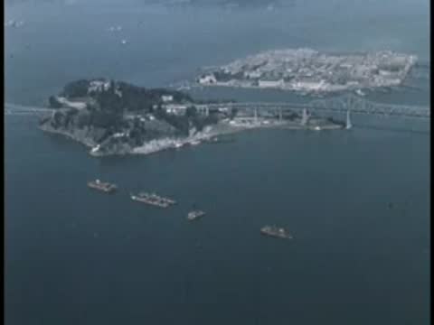 Aerial view of Alcatraz Island and the San Francisco Bay with water traffic.