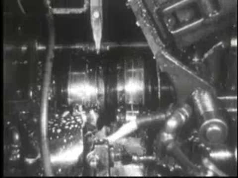 Detailed view of active mechanical machinery components operating with lubrication or fluid.