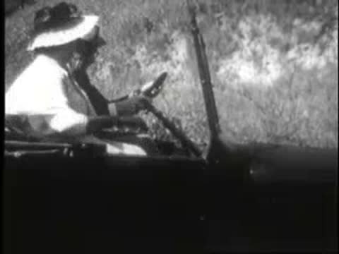 passengers inside a moving car on a dirt road