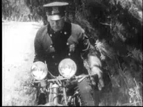 Police officer on a motorcycle preparing to chase.