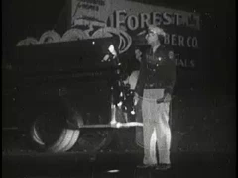 beer bottle and glass, then police officer by crashed car at night, 1960s
