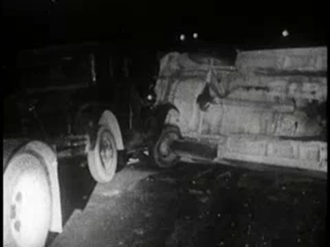 night accident scene showing overturned car and hazard text, 1960s