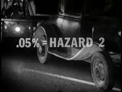 close-up of damaged car at night accident scene with text, 1960s