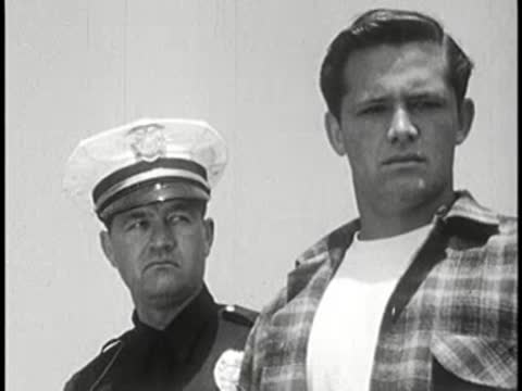 Medium shot of a police officer and a young man.