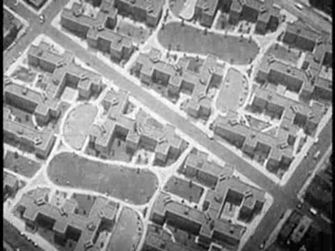 Aerial view of a city neighborhood showing apartment blocks and a park.