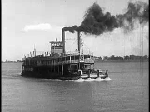 Old steam paddleboat cruising on a calm river