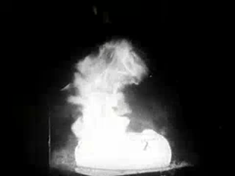 Large explosion or burst of steam in an industrial setting.