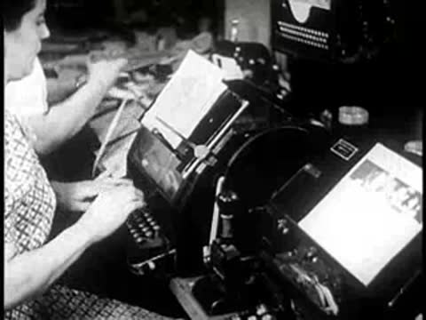 Office workers operating specialized business machines and equipment, 1940s technology