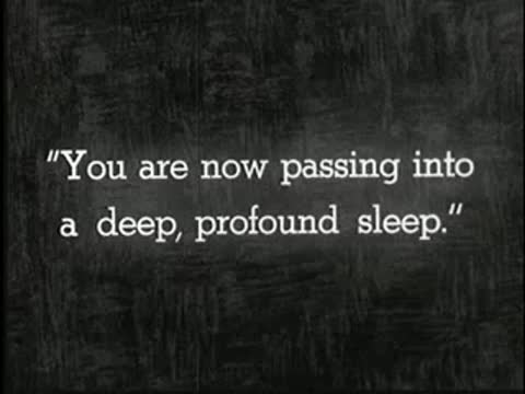 Intertitle about passing into a deep, profound sleep, static black and white.