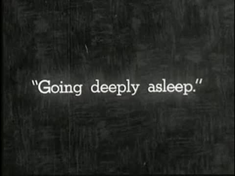 Intertitle stating "Going deeply asleep.", static black and white.
