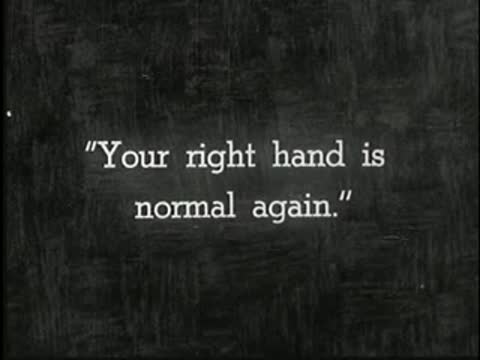Intertitle on dark background reading: Your right hand is normal again.