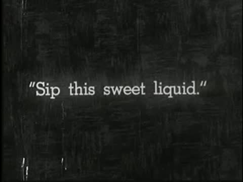 Intertitle on dark background reading: Sip this sweet liquid.