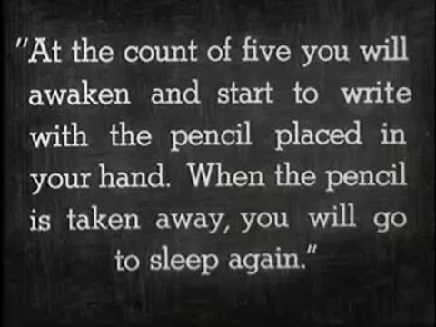 Intertitle with instructions about waking up and writing with a pencil.