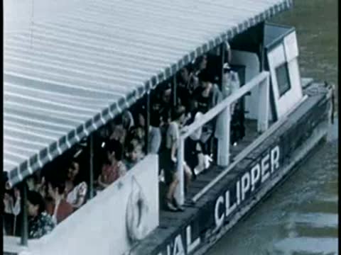 Canal Clipper boat filled with passengers cruising, 1940s film style