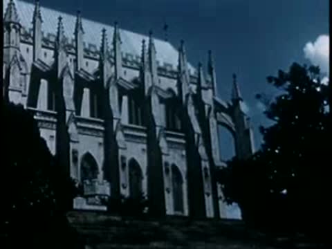 Detailed Gothic cathedral exterior facade with large windows, 1940s film style