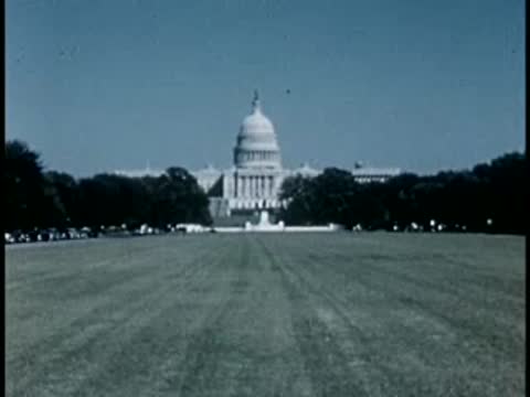 Wide lawn leading to the US Capitol building, 1940s film style