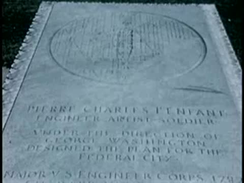 Close-up panning shot of Pierre Charles L'Enfant's grave marker in Arlington.