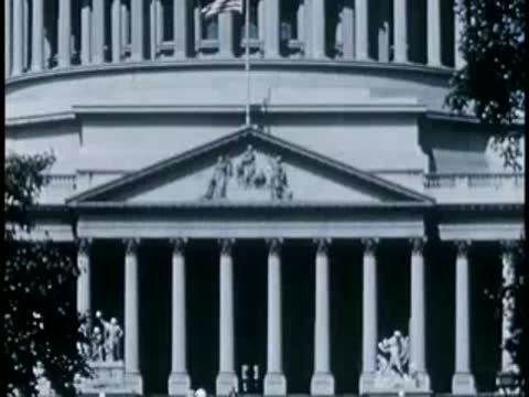Medium shot of the U.S. Capitol entrance and colonnade, 1940s.