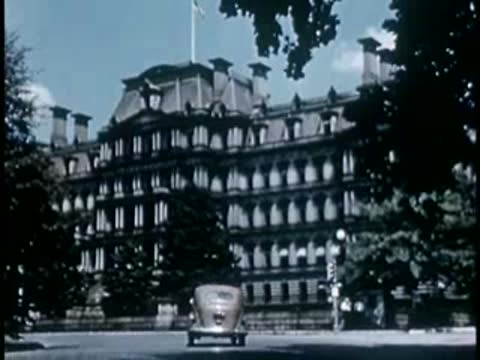 Large government building exterior with cars passing, Washington D.C., 1946