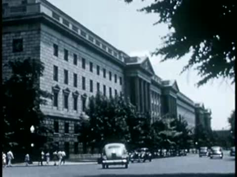 Government building exterior with parked cars, Washington D.C., 1946