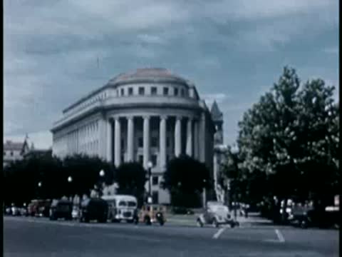 Government building with classical columns and cars, Washington D.C., 1946