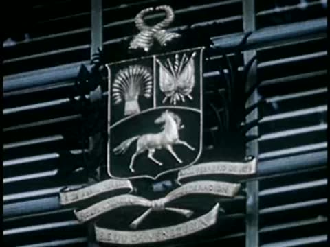 Emblem with a horse and text mounted on a wall