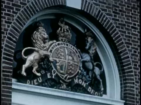 Coat of arms with lions and unicorn mounted above a doorway