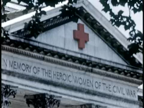 Building facade with American Red Cross emblem and inscription