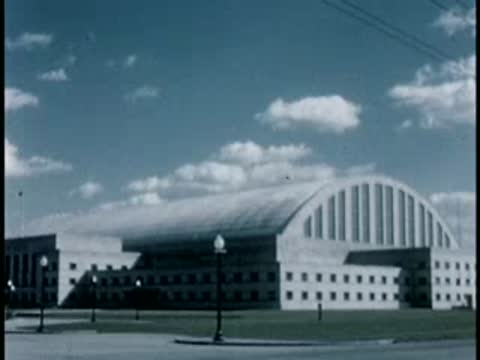 American Red Cross building facade cuts to a large warehouse structure