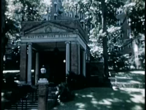 Entrance to a building with classical columns and arched portico