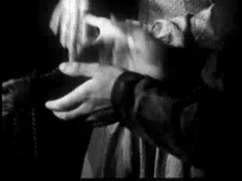 person clapping hands during folk dance event indoors
