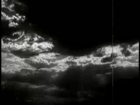 Clouds moving rapidly across the night sky.