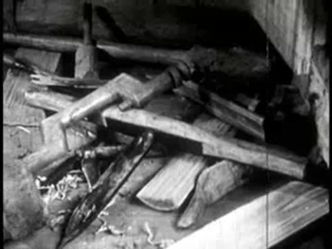 close-up of various wooden tools and scraps stacked in a workshop