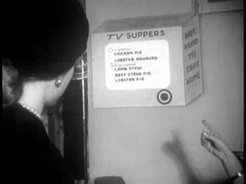 close view of a sign advertising TV suppers with menu list