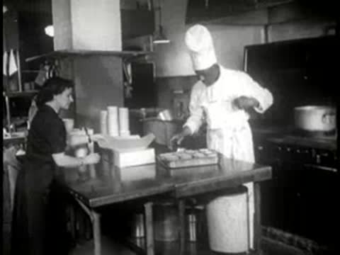 chef and staff packaging baked pies in the kitchen