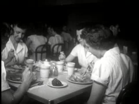 people eating meals together at a restaurant table