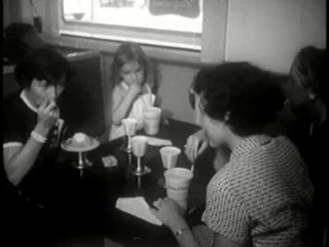 diners eating and drinking at a restaurant table