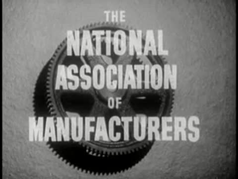 intertitle graphic for the National Association of Manufacturers over a gear background