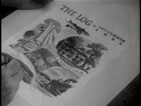 Close-up view of hands sketching and painting cover art for The Log magazine